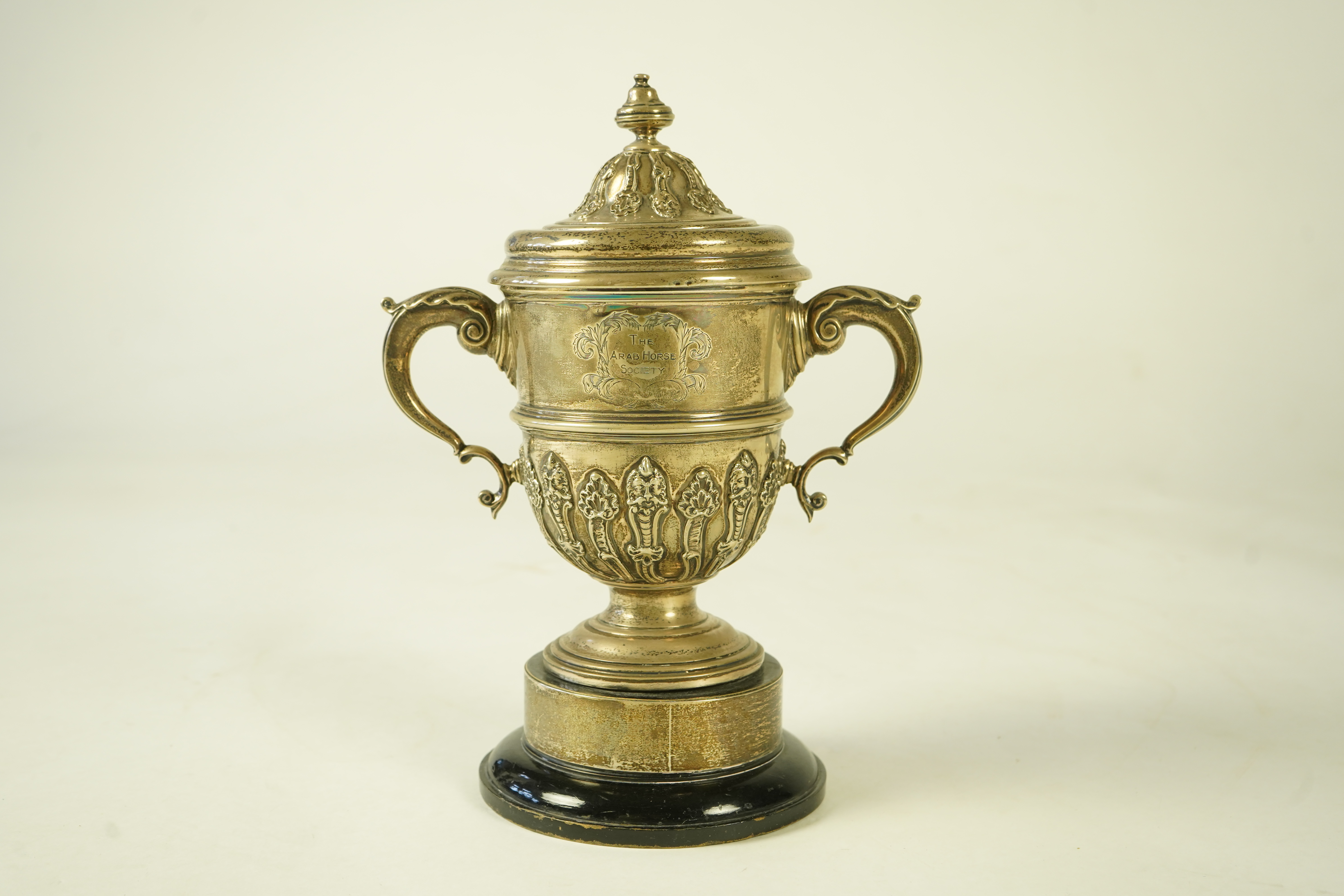 A George V silver two handled presentation cup and cover, by Charles & Richard Comyns, with engraved horse racing inscription relating to 'The Arab Horse Society Challenge Cup Presented by The Rt. Hon. Lady Wentworth for